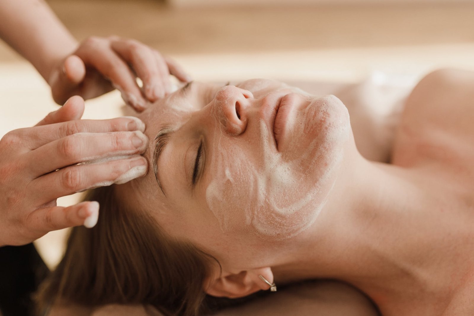 a woman having a facial treatment